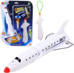 Kozmikus hajó fényes ejtőernyővel és csúzlival