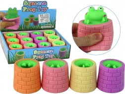 Zöld béka stresszoldó játék hordóból ugrik ki