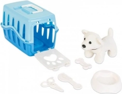 Kiskutya kék szállítóboxban