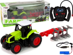 RC traktor 1:16 gumírozott kerekekkel és levehető ekével
