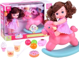 Baba rózsaszín pöttyös ruhában hintalóval és kiegészítőkkel