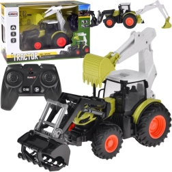 Távirányítós traktor markolóval és rakodóval