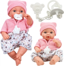 Szövet baba sapkával és hangokkal