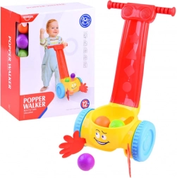 Zenélő járássegítő labdavadásszal