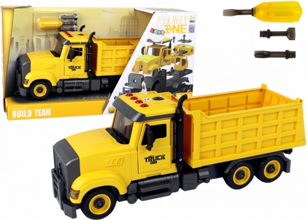 Sárga billenőplatós autó hangokkal és csavarozó készlettel