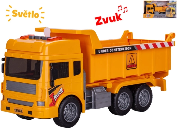 Lendkerekes billenőplatós építőjármű fénnyel és hanggal, 27 cm