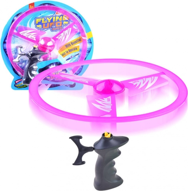 Repülő korong kilövővel és fényhatással – Rózsaszín
