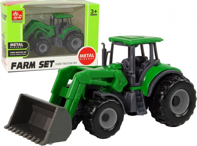 Kis zöld traktor rakodóval