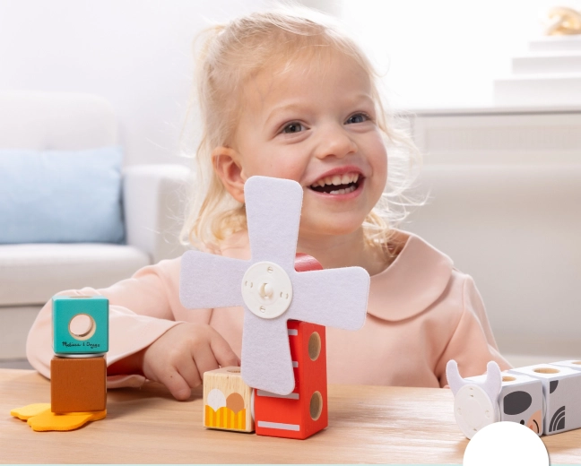 Interaktív szélkerék és játékos farmmotívumok