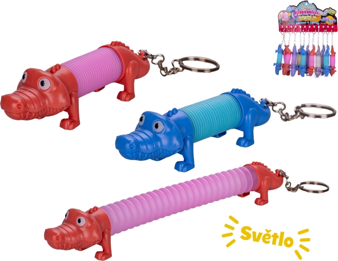 Felhúzható krokodilos kulcstartó fénnyel