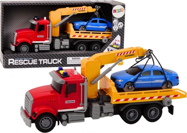 Piros vontatóautó daruval és fényhatásokkal