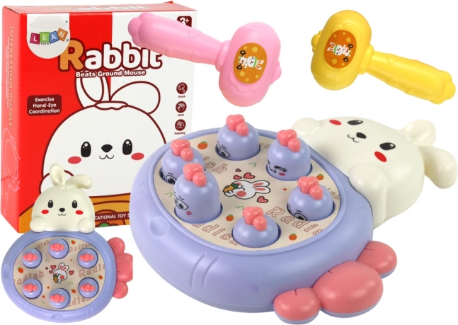 Whac-A-Mole lila játék répával és nyuszival