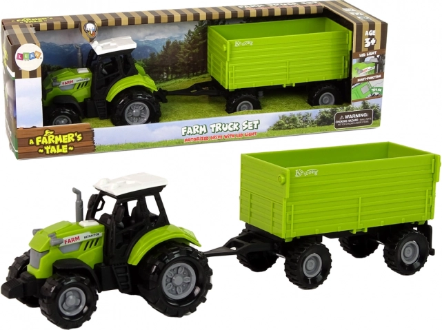 Zöld mezőgazdasági traktor pótkocsival