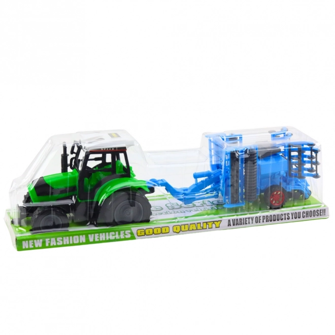 Nagy mezőgazdasági traktor tárcsás boronával
