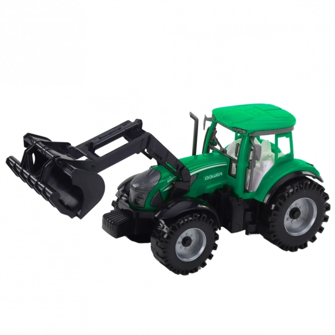 Zöld traktor rakodóval és kompatibilis bálázóval