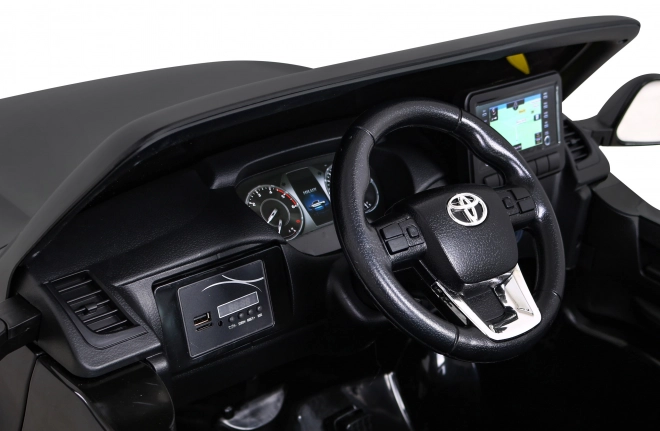 Toyota Hilux akkumulátor gyerekeknek fekete + 4x4 hajtás + távirányító + 2 csomagtartó + MP3 rádió + LED dióda
