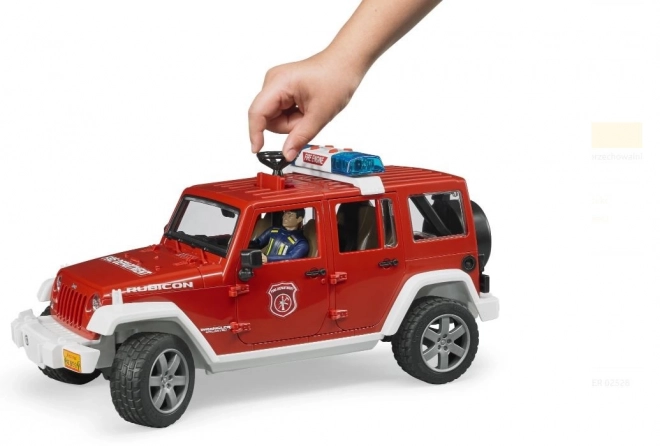 Bruder piros tűzoltó Jeep Wrangler figurával és kiegészítőkkel