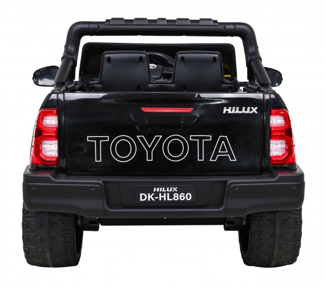 Toyota Hilux akkumulátor gyerekeknek fekete + 4x4 hajtás + távirányító + 2 csomagtartó + MP3 rádió + LED dióda