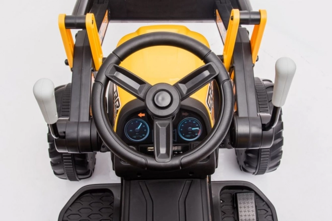 Akkumulátoros traktor kanállal sárga