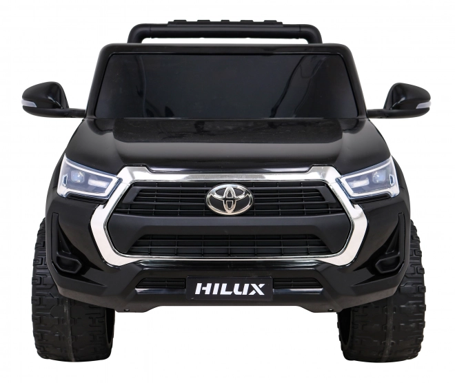 Toyota Hilux akkumulátor gyerekeknek fekete + 4x4 hajtás + távirányító + 2 csomagtartó + MP3 rádió + LED dióda