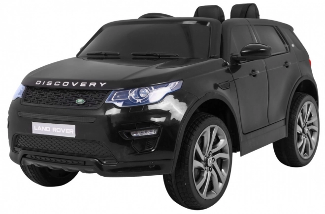 Land Rover Discovery gyerekeknek fekete + Távirányító + 5 pontos biztonsági övek + Ülőhely beállítása + EVA + MP3 LED