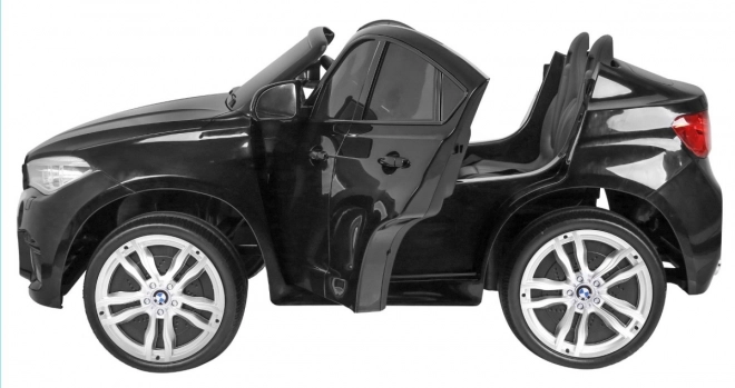 BMW X6M XXL pro 2 gyerek fekete + Távirányító + Eko bőr + Biztonsági övek + Lassú indítás + MP3 USB + LED dióda