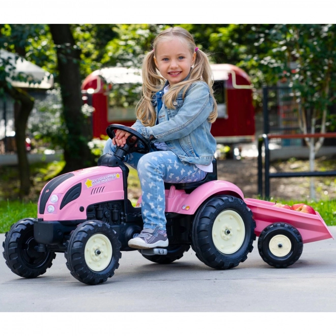Lánctalpas rózsaszín traktor utánfutóval