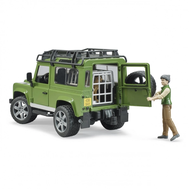 bruder land rover defender vadász figurával és kutyával