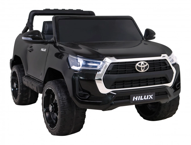 Toyota Hilux akkumulátor gyerekeknek fekete + 4x4 hajtás + távirányító + 2 csomagtartó + MP3 rádió + LED dióda