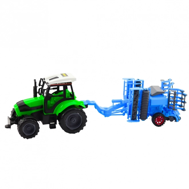 Nagy mezőgazdasági traktor tárcsás boronával