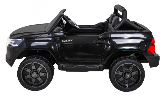 Toyota Hilux akkumulátor gyerekeknek fekete + 4x4 hajtás + távirányító + 2 csomagtartó + MP3 rádió + LED dióda