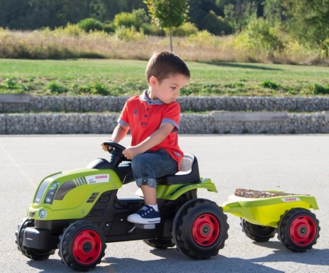 Zöld Claas pedálos traktor utánfutóval