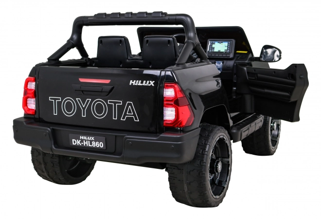 Toyota Hilux akkumulátor gyerekeknek fekete + 4x4 hajtás + távirányító + 2 csomagtartó + MP3 rádió + LED dióda