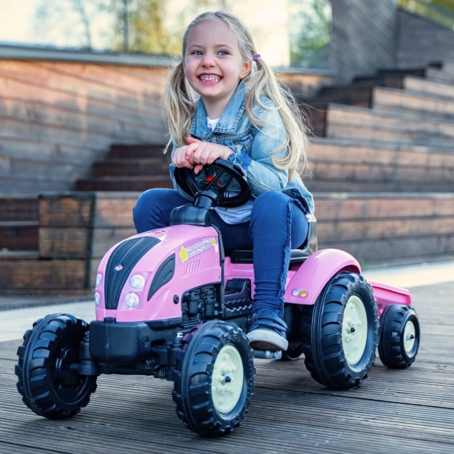 Lánctalpas rózsaszín traktor utánfutóval