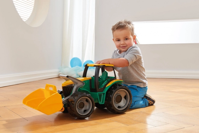 Traktor markolókanállal és ásóval zöld-sárga