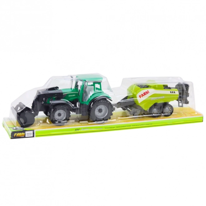 Zöld traktor rakodóval és kompatibilis bálázóval
