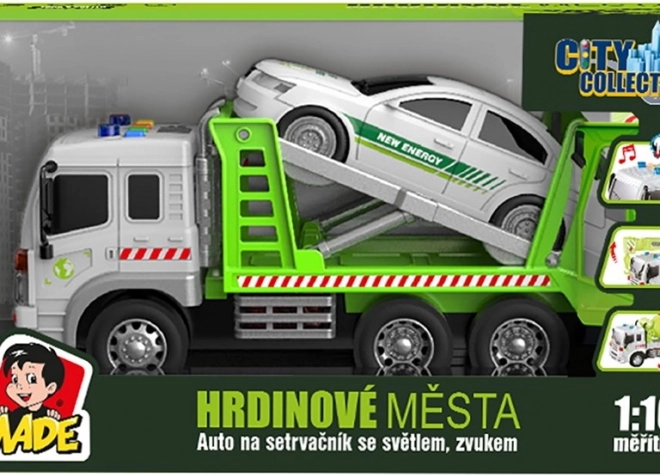 Vontatóautó lendkerekes járművel, fénnyel és hanggal