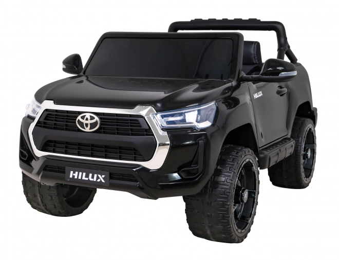 Toyota Hilux akkumulátor gyerekeknek fekete + 4x4 hajtás + távirányító + 2 csomagtartó + MP3 rádió + LED dióda