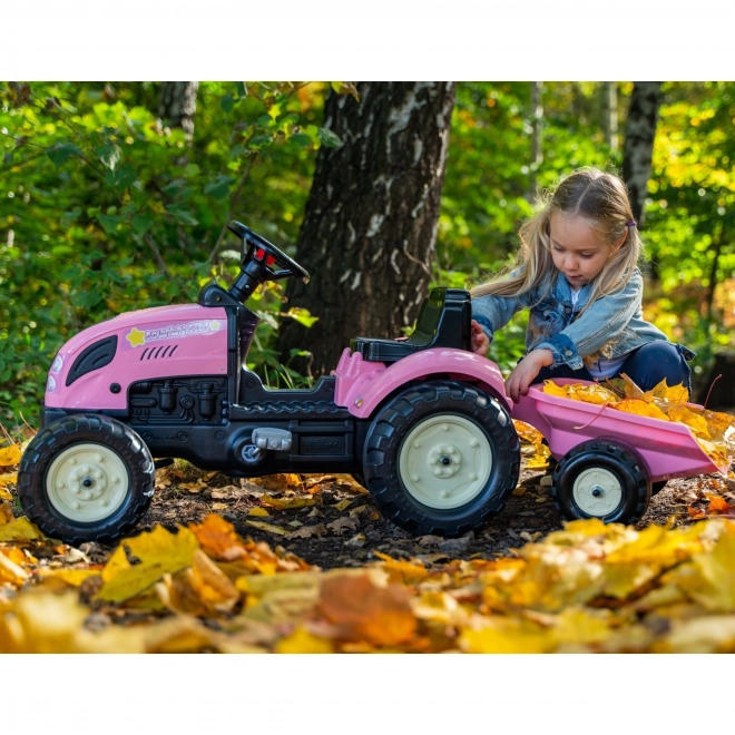 Lánctalpas rózsaszín traktor utánfutóval