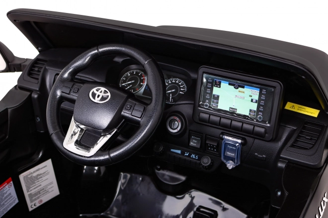 Toyota Hilux akkumulátor gyerekeknek fekete + 4x4 hajtás + távirányító + 2 csomagtartó + MP3 rádió + LED dióda