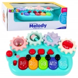 Interaktív gyerek zongora fogaskerekekkel kék