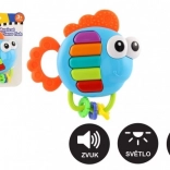 Zenélő csörgő és rágóka halacska fénnyel és hanggal, 14 × 14 cm, 3 hónapos kortól