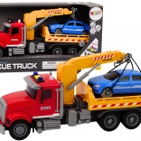 Piros vontatóautó daruval és fényhatásokkal