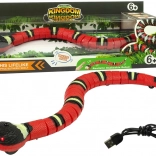 Interaktív, érintéssel vezérelhető kígyó piros-fekete csíkokkal