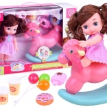 Baba rózsaszín pöttyös ruhában hintalóval és kiegészítőkkel