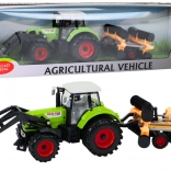 Traktor tárcsás boronával és homlokrakodóval zöld